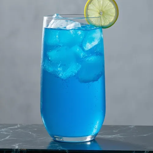 A vibrant blue 'Adios Motherfucker' cocktail served in a highball glass filled with ice.